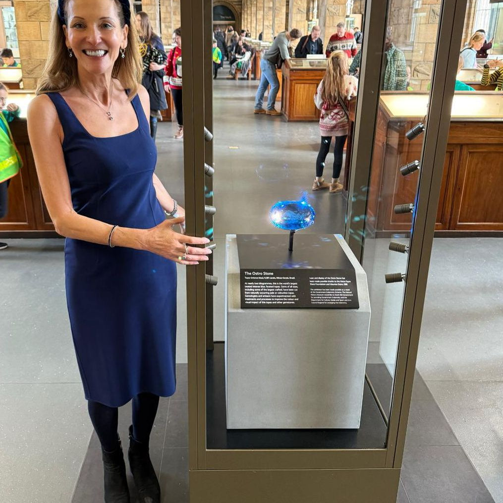 Founder Katy Ostro at Natural History Museum with Ostro Blue topaz gemstone - world's largest blue topaz on display