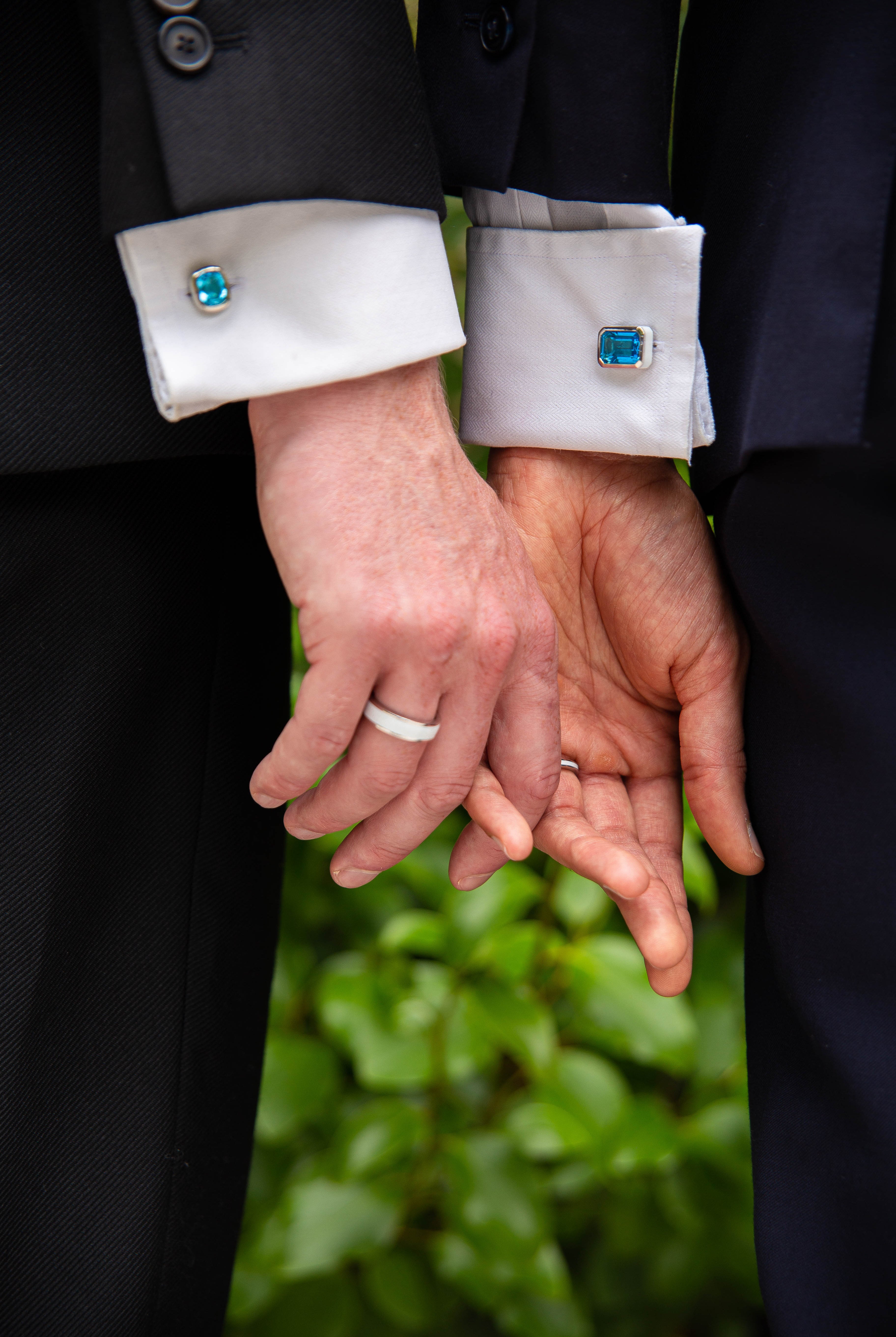 A modern couple wearing our ‘Off the Cuff’ octagon and cushion cufflinks along with the ‘Hidden Gem’ ring for him