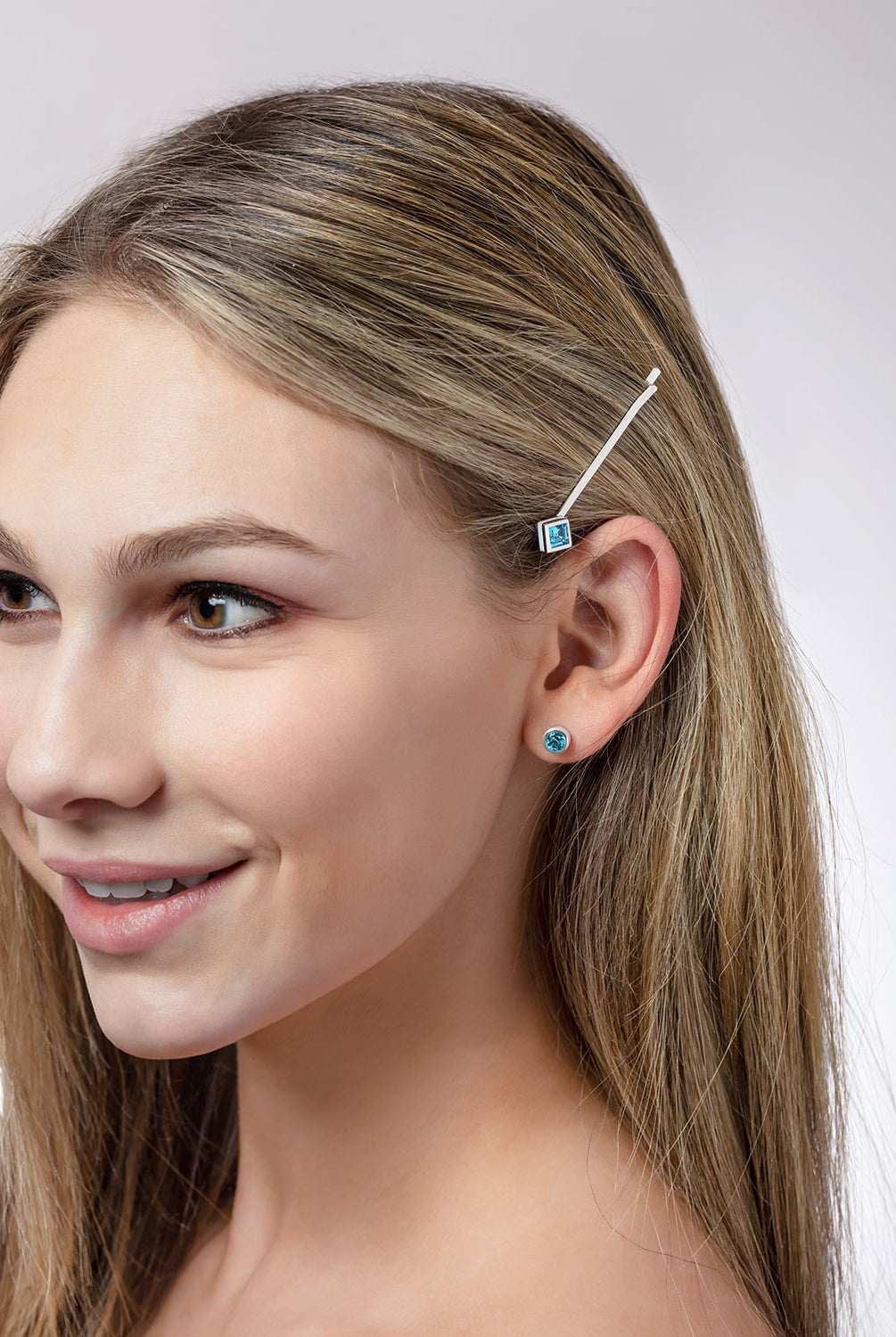 ‘Hairloom’ hair slider with a square Ostro Blue Topaz set in Sterling Silver being worn by model