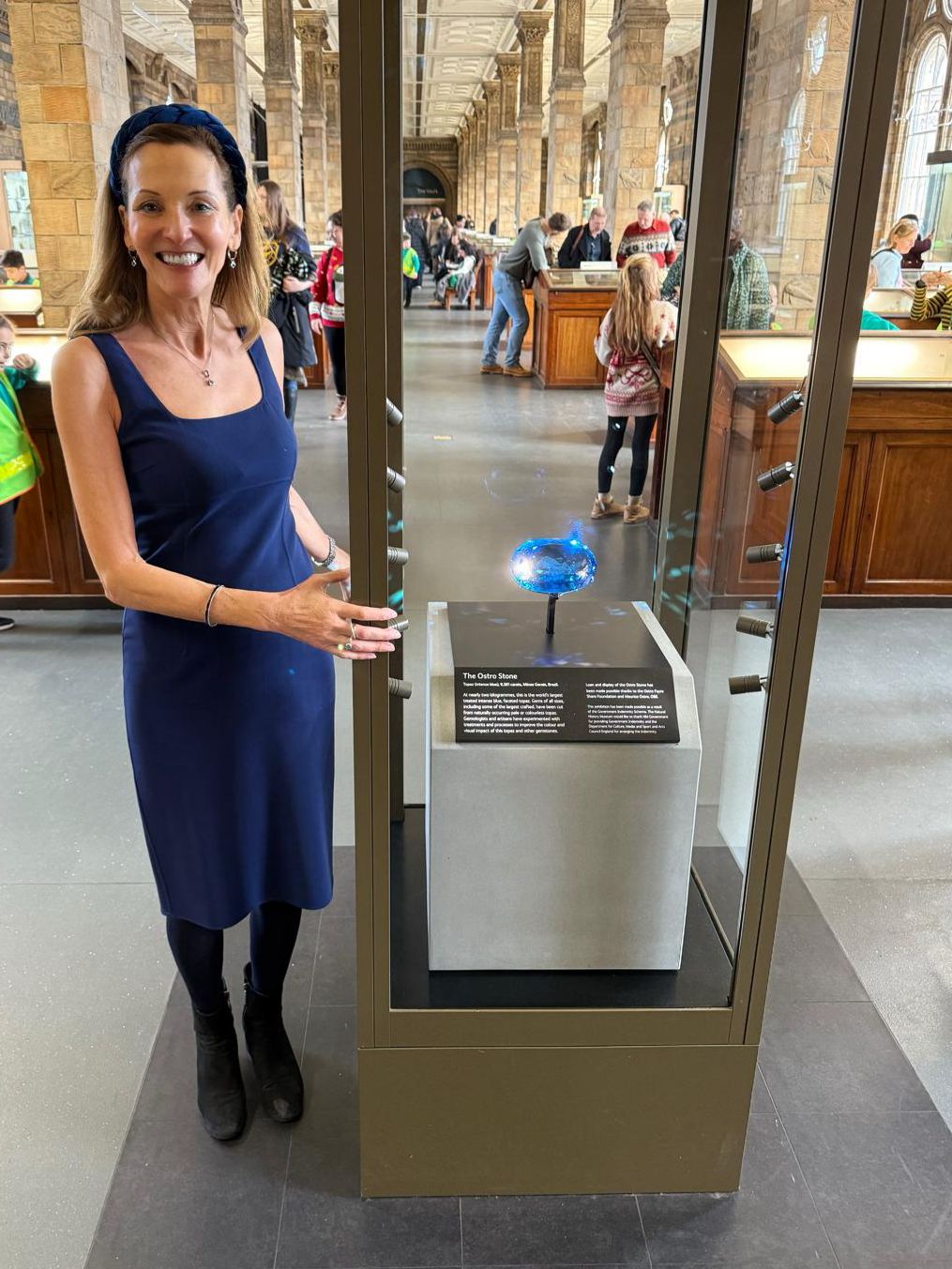 Founder Katy Ostro at Natural History Museum with Ostro Blue topaz gemstone - world's largest blue topaz on display