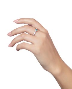 'Better together' sterling silver stacking ring with a square Ostro Blue Topaz being worn by model