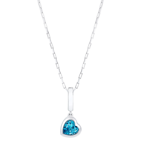 Our ‘Tradition with a twist’ charm with a heart Ostro Blue Topaz set in Sterling Silver being worn on a silver necklace