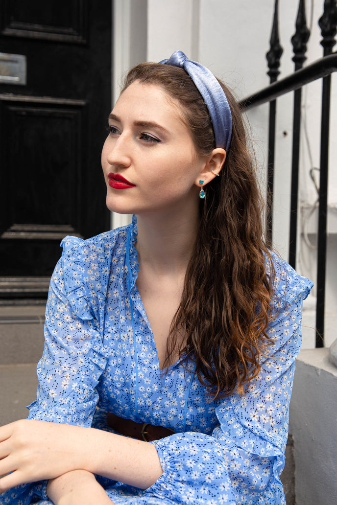 ‘Mix and Match’ earring drops with a pair of pear Ostro Blue Topaz set in sterling silver paired with our ‘Play by ear’ stud earrings with a pair of round Ostro Blue topaz set in Sterling Silver being worn by model