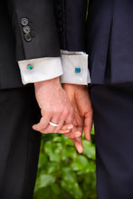 Load image into Gallery viewer, A modern couple wearing their ‘Hidden Gem’ Sterling Silver rings for him and her as well as our ‘off the Cuff’ octagon cufflinks with a pair of Octagon Ostro Blue Topaz set in sterling silver
