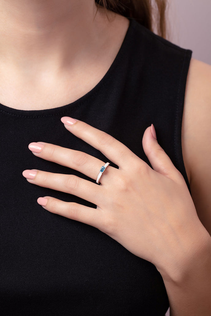 'Better together' sterling silver stacking ring with a Octagon Ostro Blue Topaz being worn by model