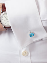 Load image into Gallery viewer, ‘Off the Cuff’ cushion cufflinks with a pair of cushion Ostro Blue Topaz set in sterling silver being worn by model
