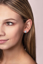 Load image into Gallery viewer, ‘Play by ear’ stud earrings with a pair of square Ostro Blue topaz set in Sterling Silver being worn by model
