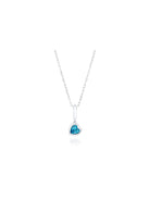 Our ‘Tradition with a twist’ charm with a heart Ostro Blue Topaz set in Sterling Silver on a silver necklace
